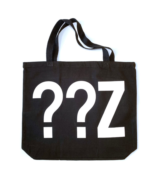 Black canvas tote bag with a white question mark on the front.