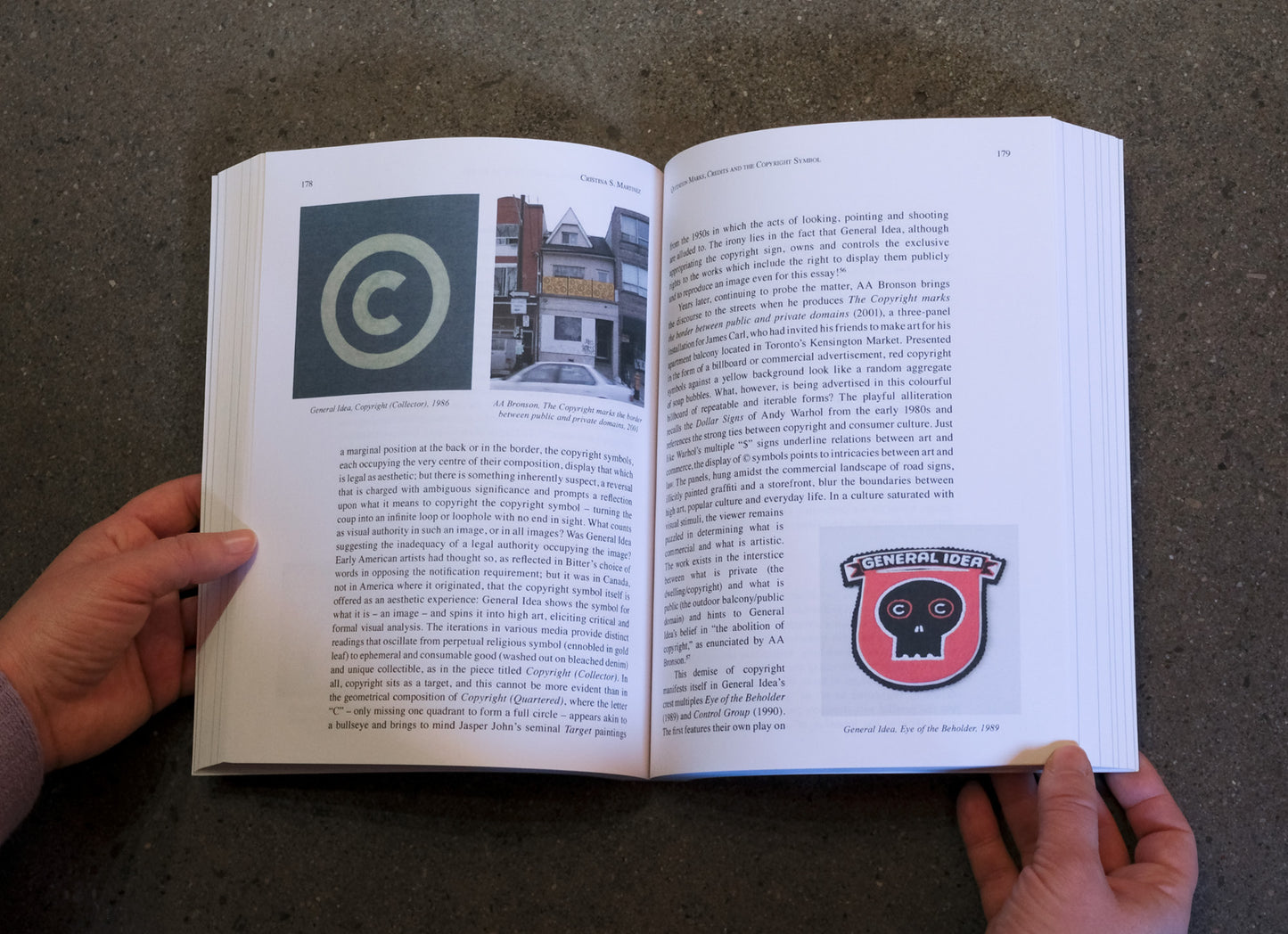 Open book with text and images on a textured surface