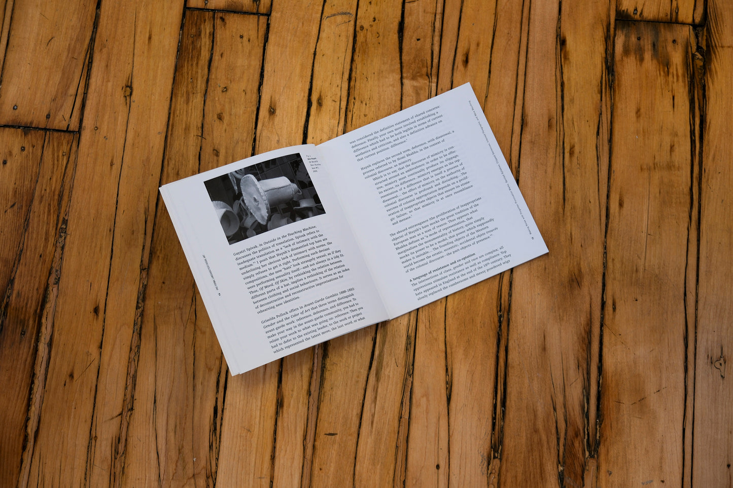 Open book on a wooden surface