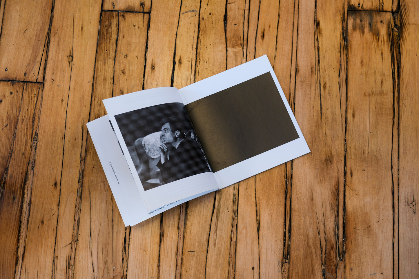 Open book on a wooden surface