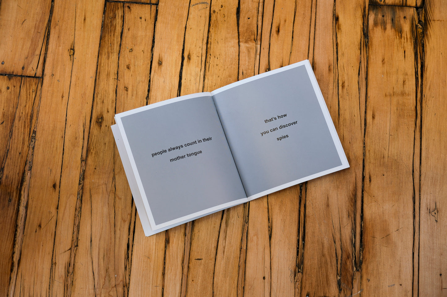 Open book with text on a wooden surface
