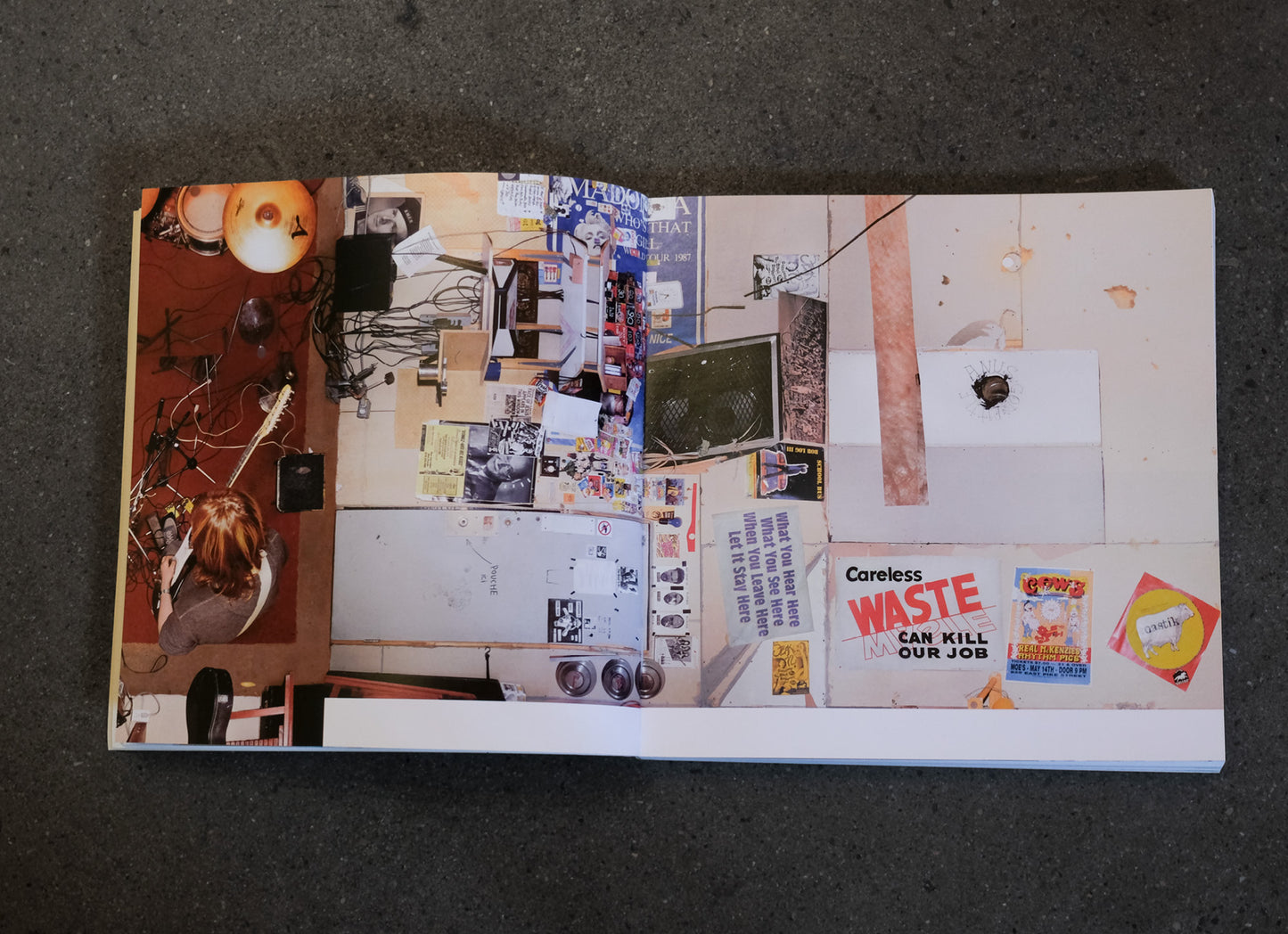 open book spread with collage of various images and text on a flat surface
