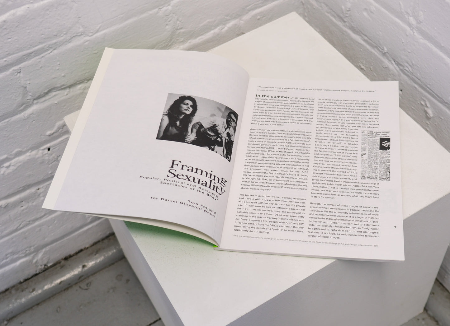 Open book on a white surface with text and images.