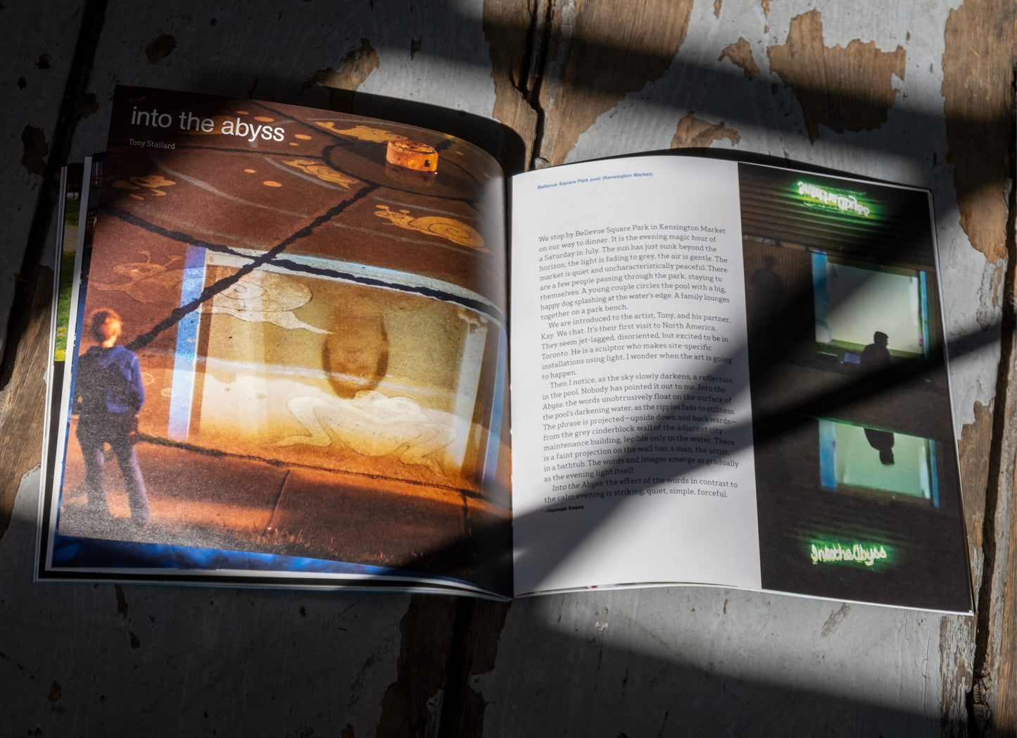 Wade Catalogue opened to show pages, on a wood floor with moody shadows