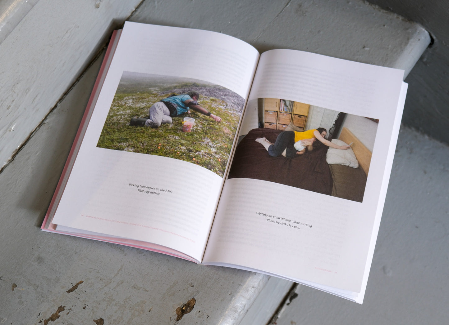 Open book with two photographs on a textured surface